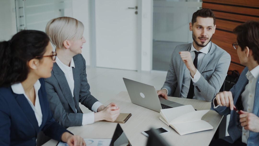 Small group of professionals discussing around a table