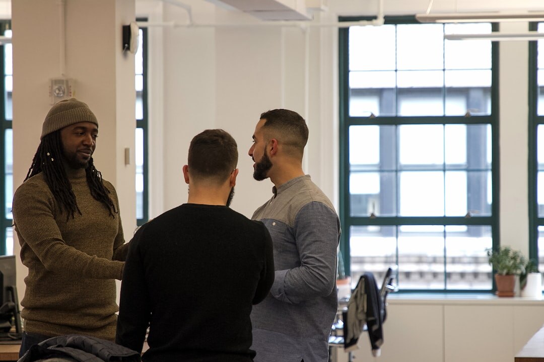 Professional making introductions between two colleagues at an event