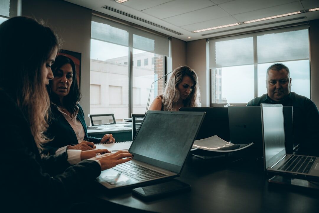 Team reviewing growth charts on a laptop during a meeting