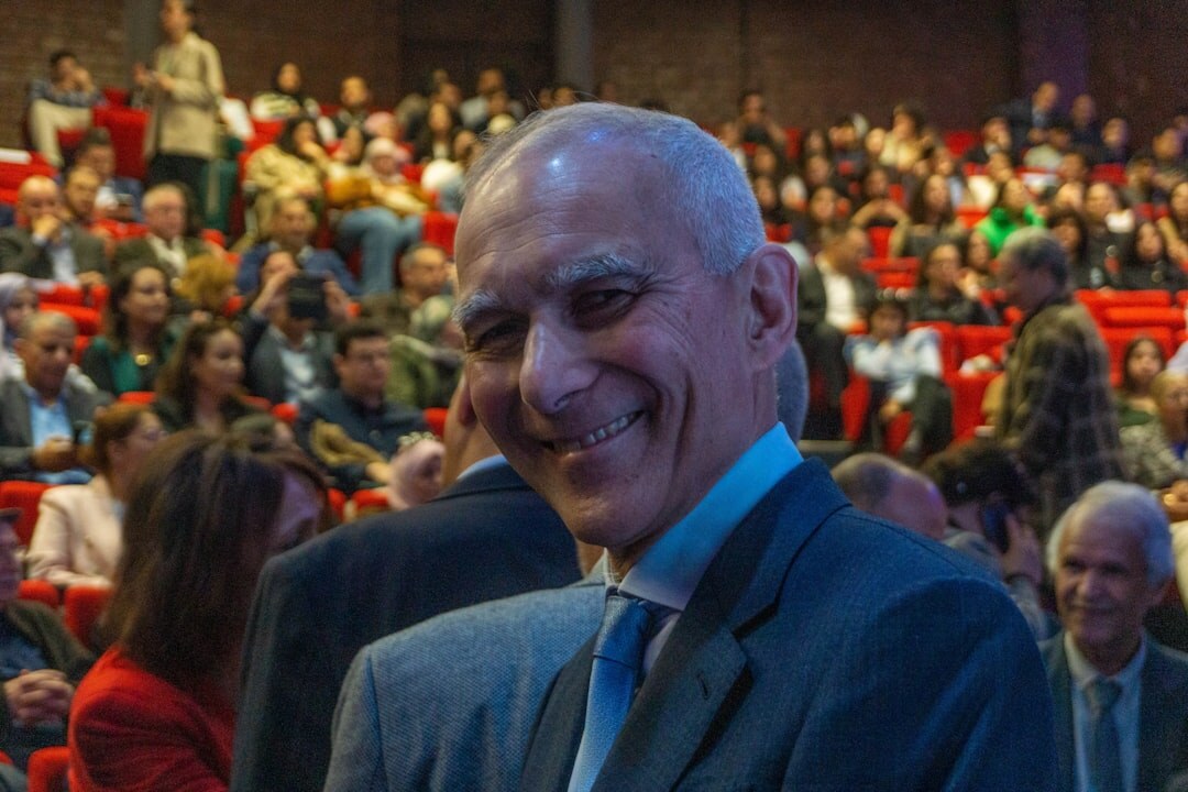 Audience attending a business conference in an auditorium